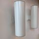 Pair of vintage cylindrical wall lights, matt white metal, Germany Erco 1976