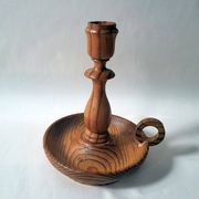 Vintage candlestick holder crafted from turned pine wood Scandinavian-style
