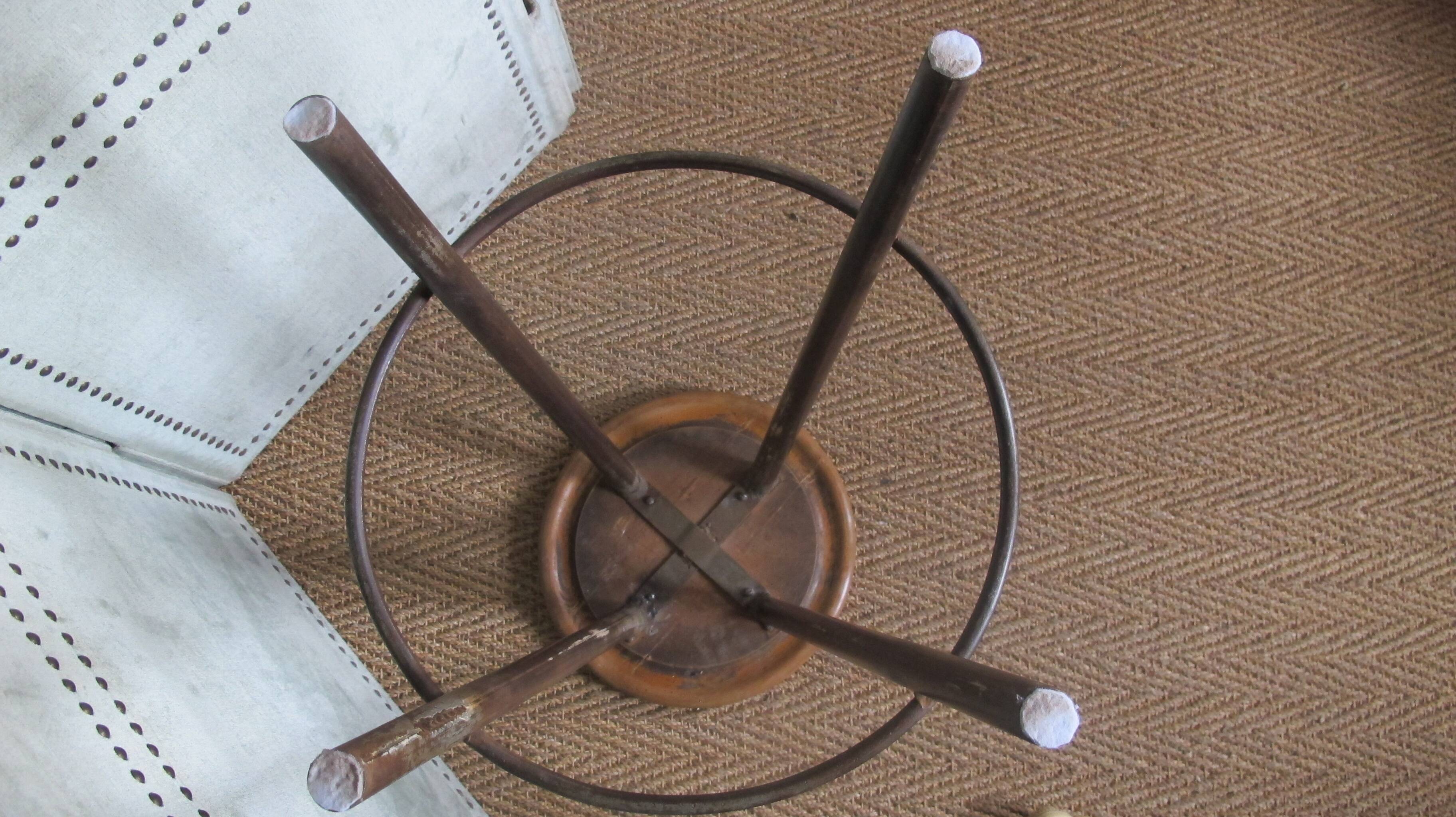 high factory stool made of wood and metal