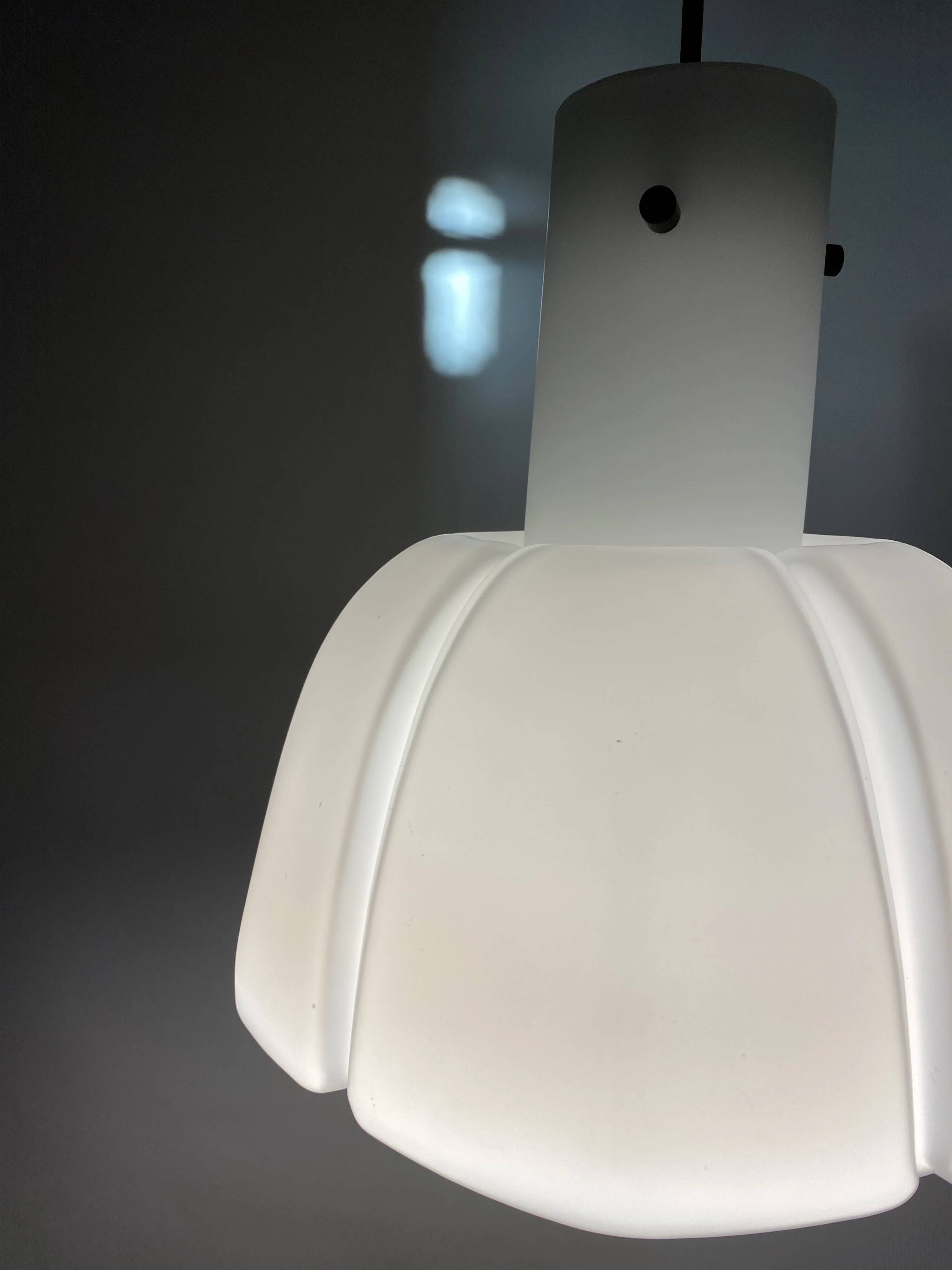 Frosted glass pendant in the shape of a white flower by Glashütte Limburg.