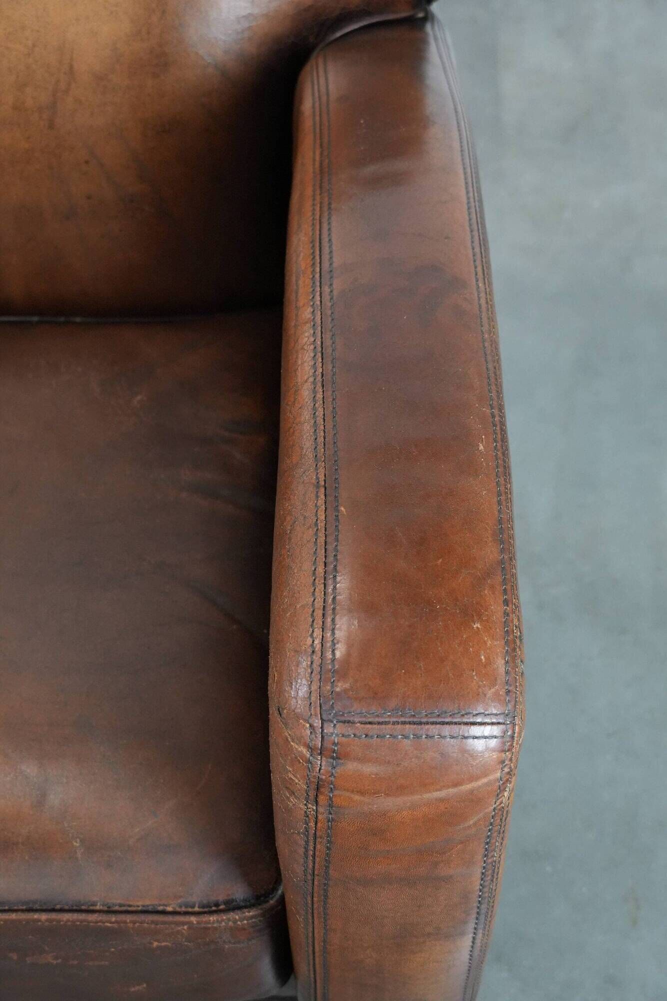 Characterful set of two vintage sheepskin armchairs with beautiful colours