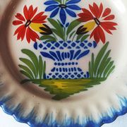 Pair of antique plates in popular earthenware with a floral basket decoration on the edge.
