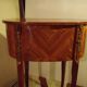 Louis XV style bedside table with varnished marquetry.