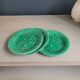Three green slip plates
