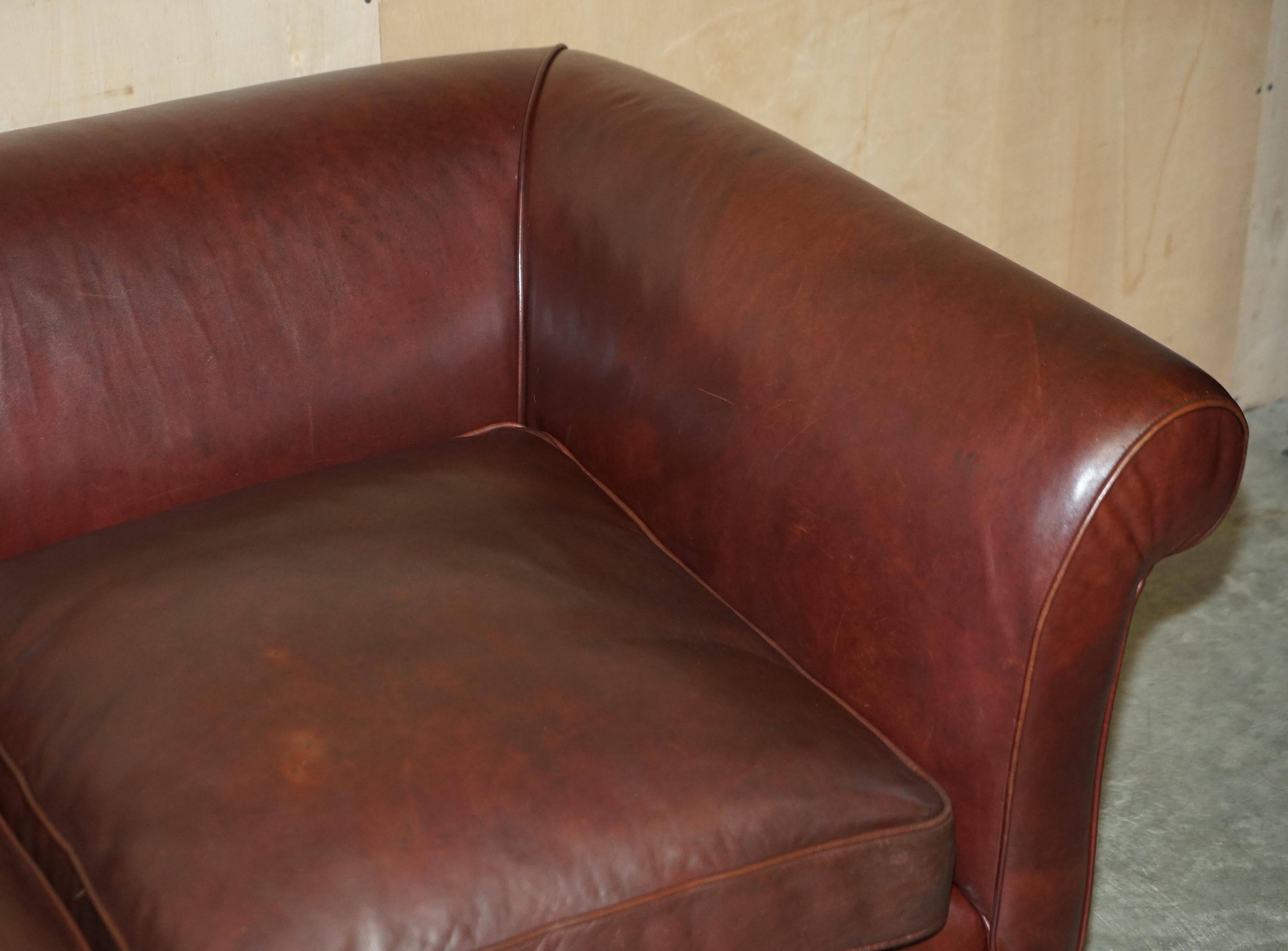 Vintage Art Deco leather sofa, three-seater, feather cushions.