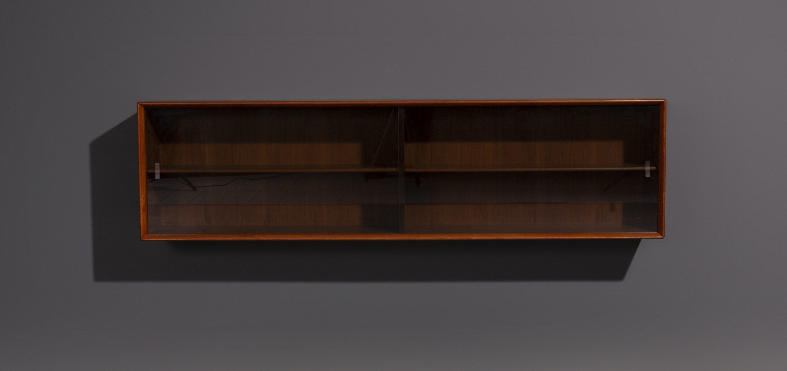 Teak wall cabinet with sliding glass doors