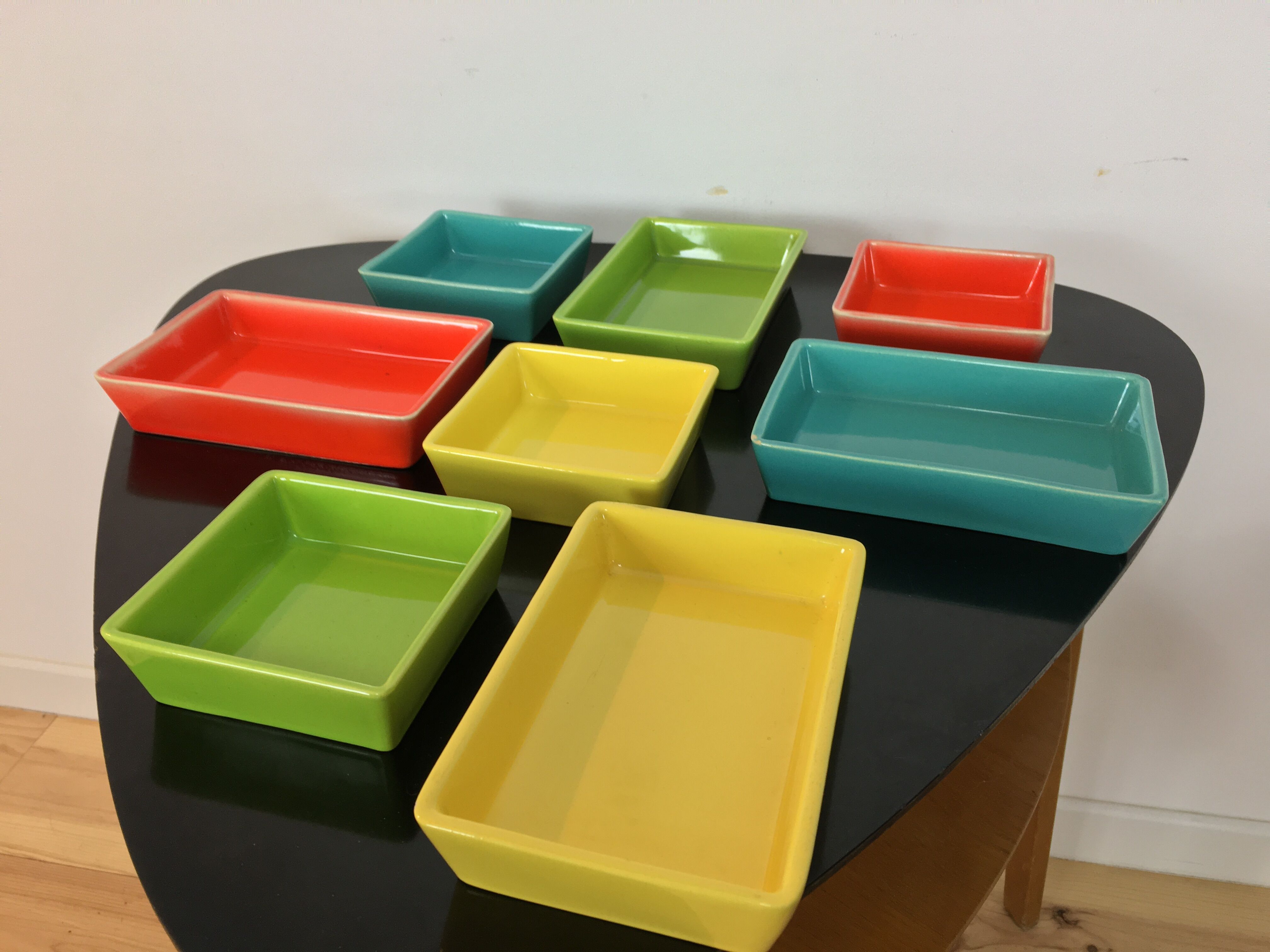 Black metal appetizer set with colorful ceramic ramekins