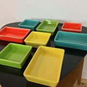 Black metal appetizer set with colorful ceramic ramekins