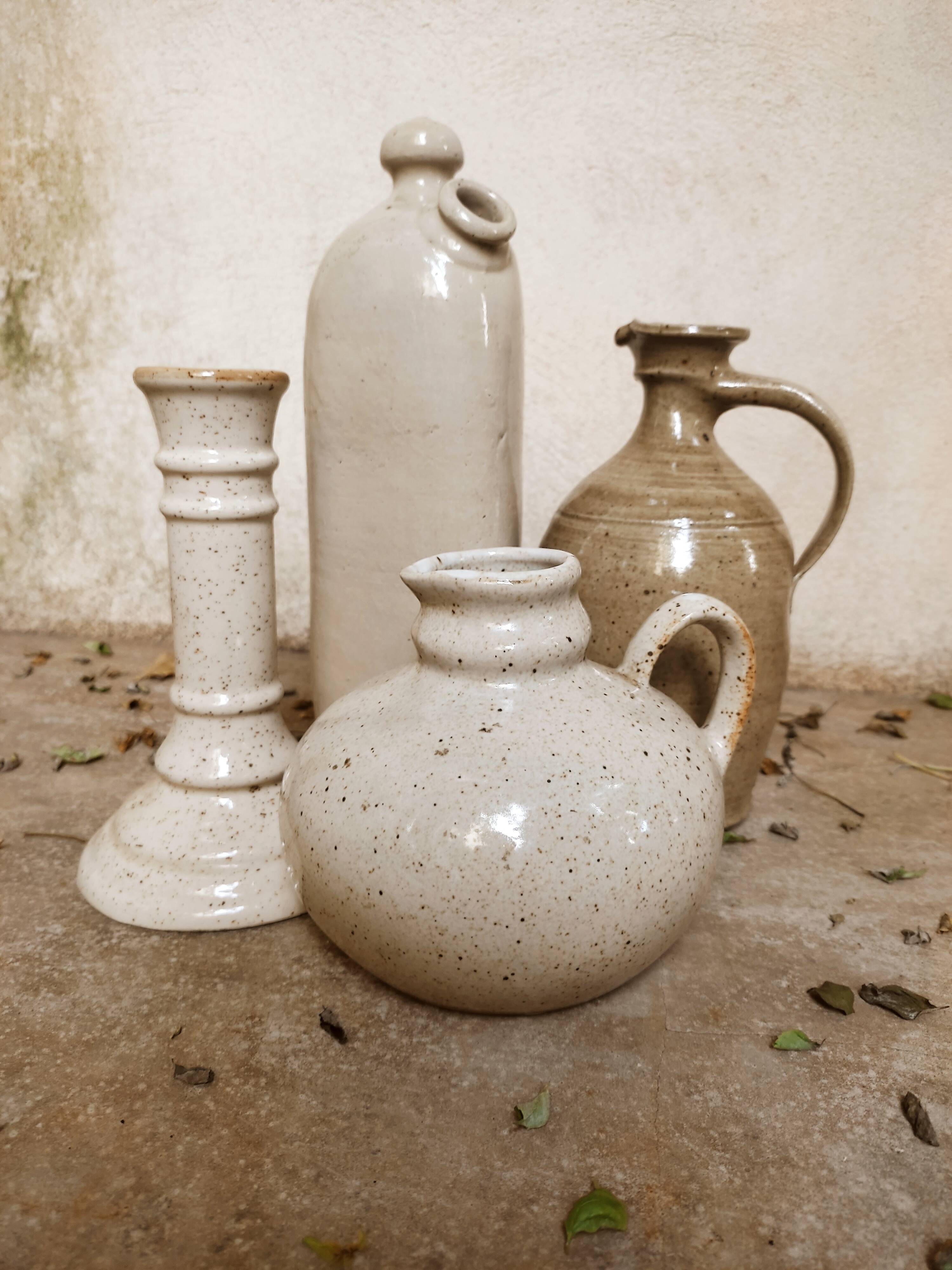 Stoneware decanters and candle holder