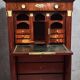 Rare four-column secretary from the Empire period in flame mahogany and bronze.