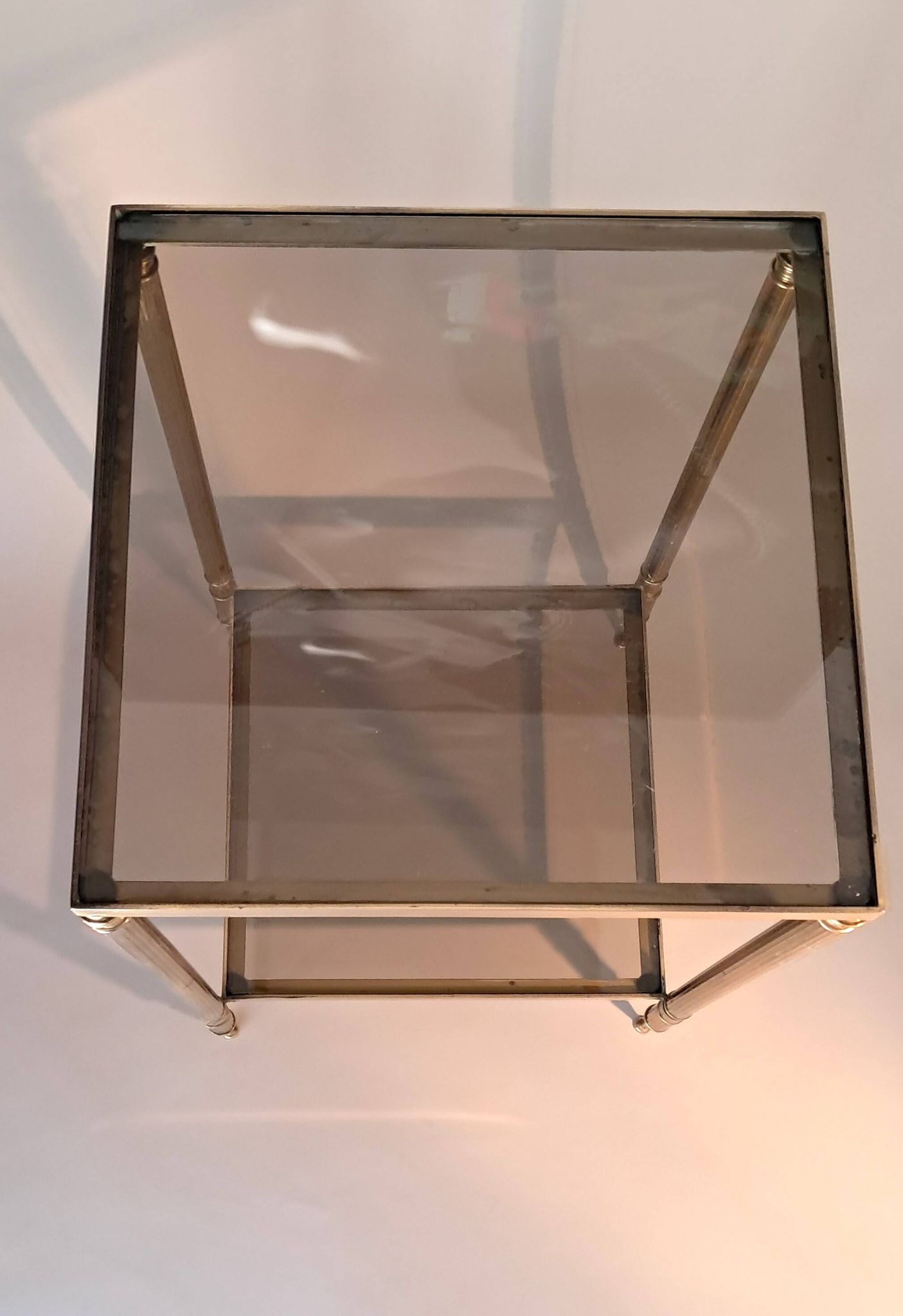 Gilded brass and smoked glass end table, 1960s.
