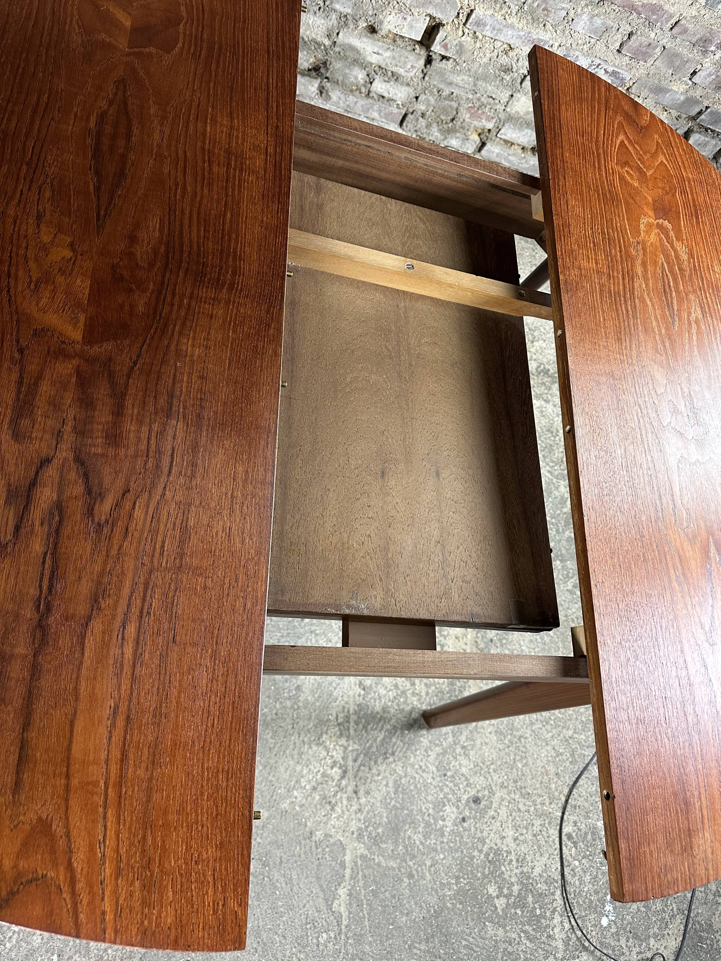 Scandinavian round teak table with integrated extension 70'S