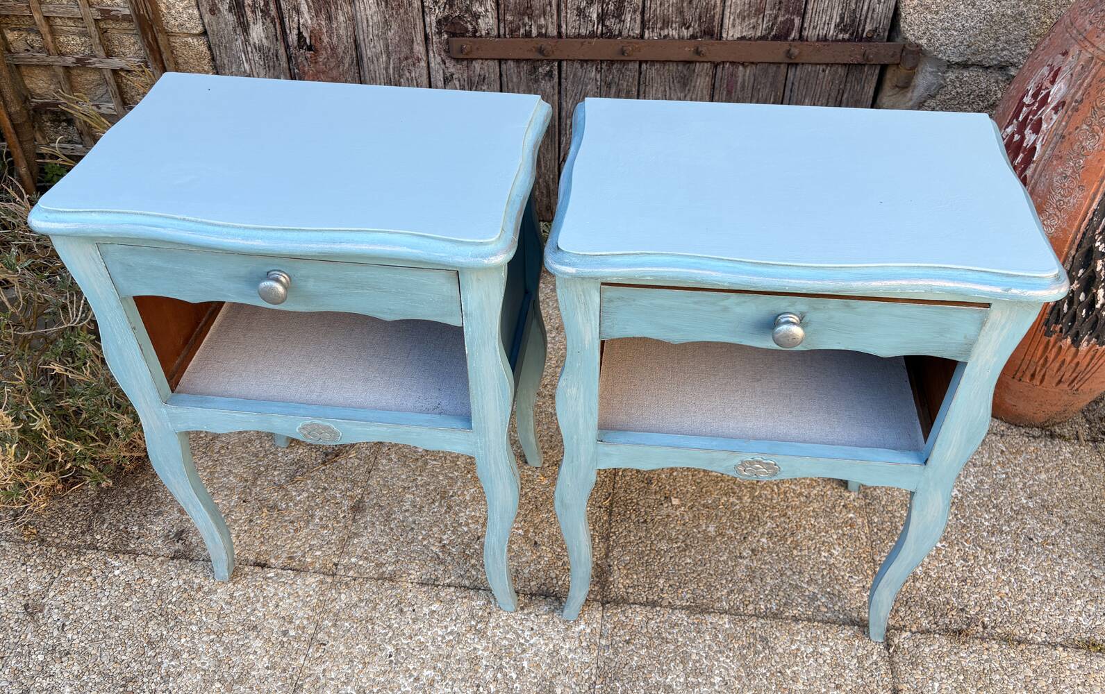 Pair of patinated lagoon blue bedside tables, early 20th century, with curved legs.