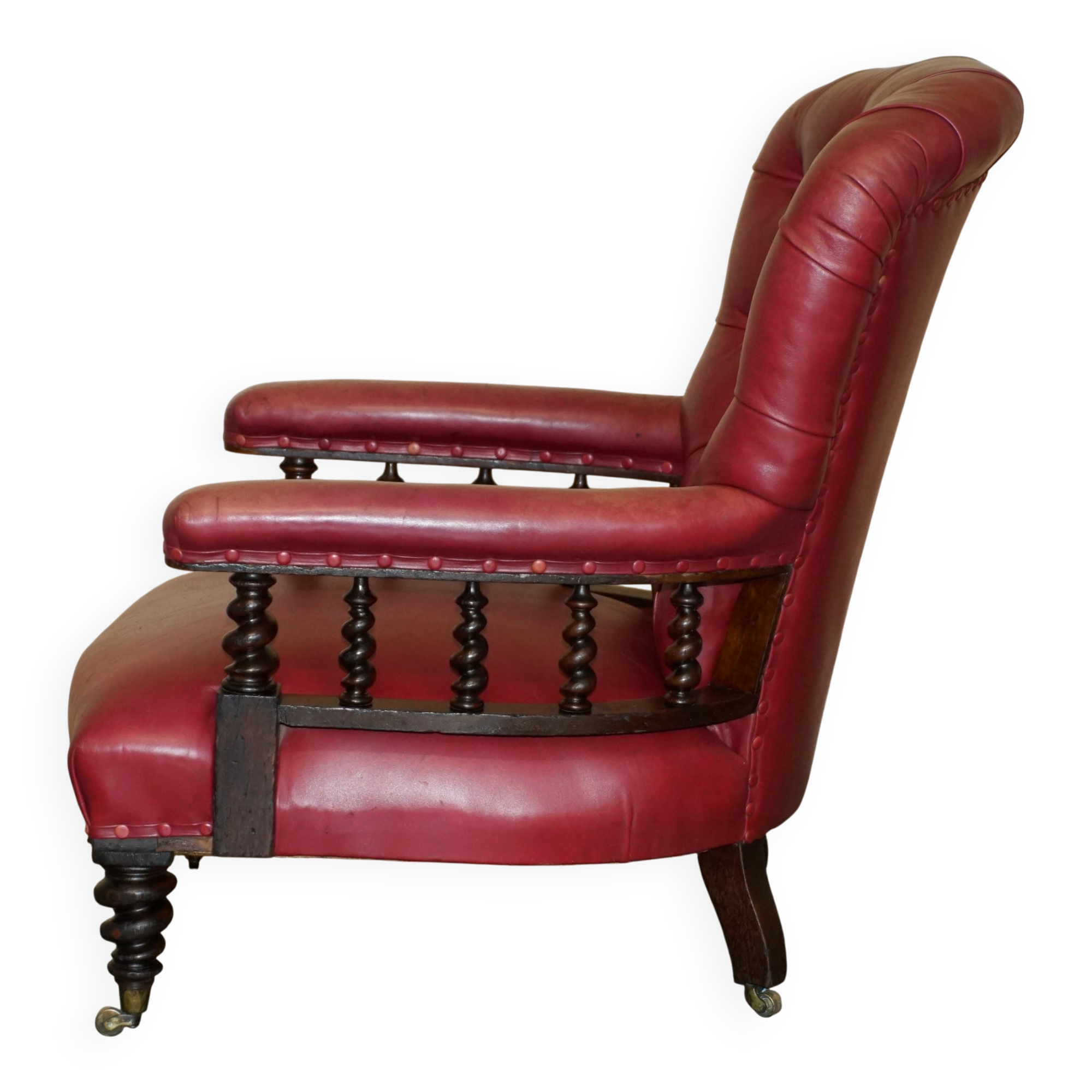 William IV antique Chesterfield armchair in leather with twisted barley structure.
