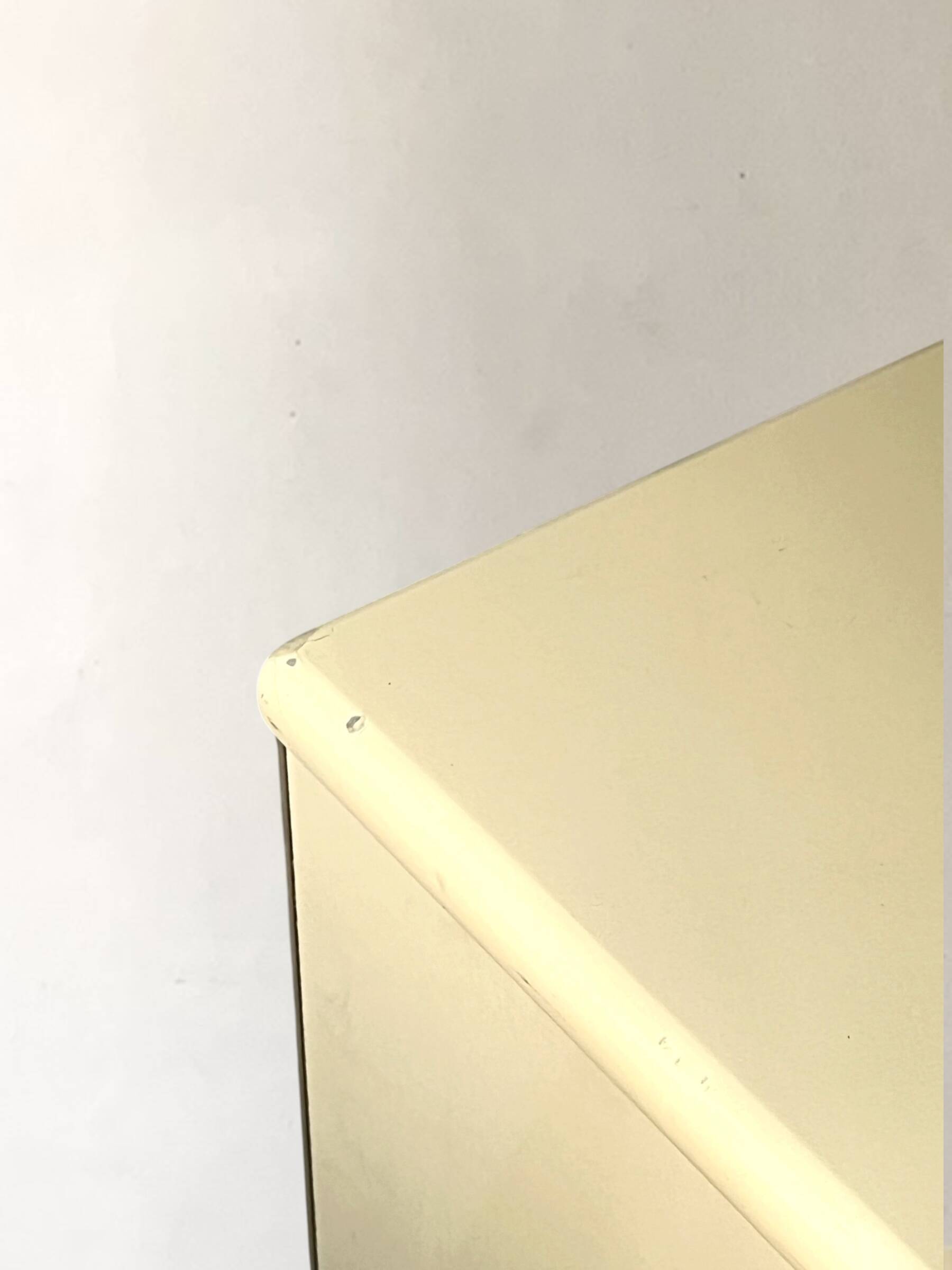 Commode type sideboard with 8 drawers, ivory lacquer and brass details, 1970s design.