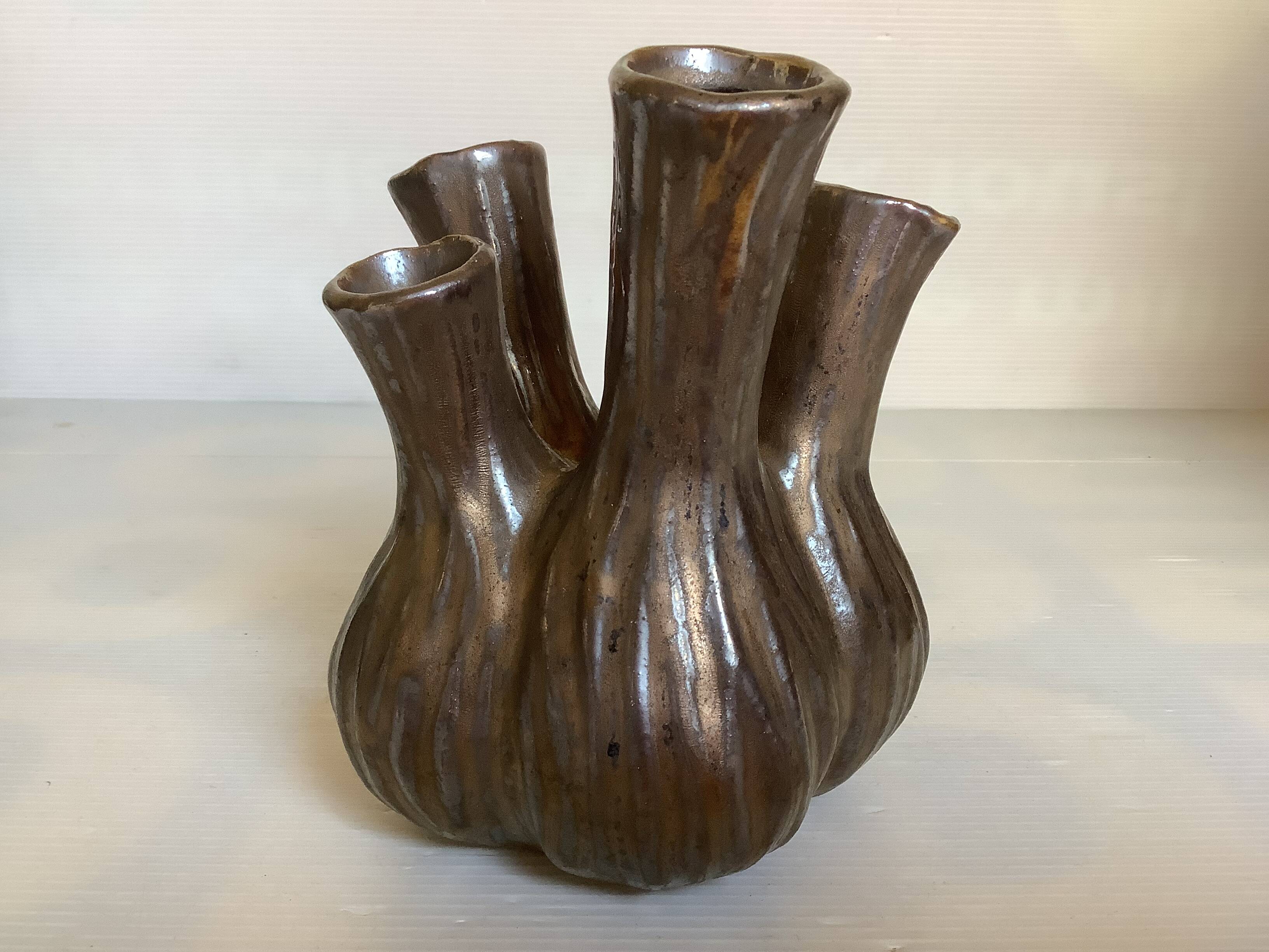 Tulip vase with ceramic flowers in brown and gold.