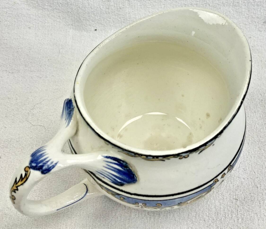 Old cream jug for children at the Dionysos press Gien
