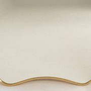 Patinated brass-framed mirror. 1980s/90s.