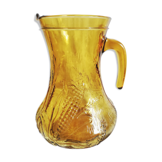 Vintage pitcher in engraved amber yellow glass