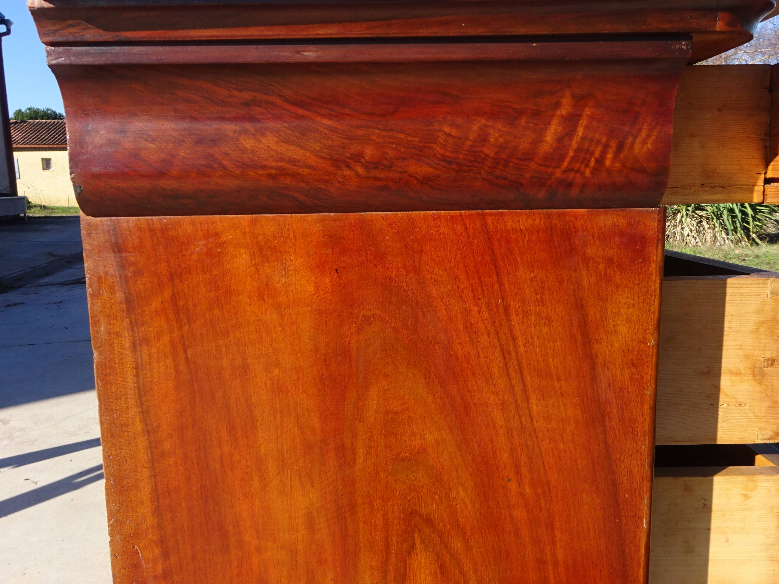 Antique mahogany chest of drawers with white marble.