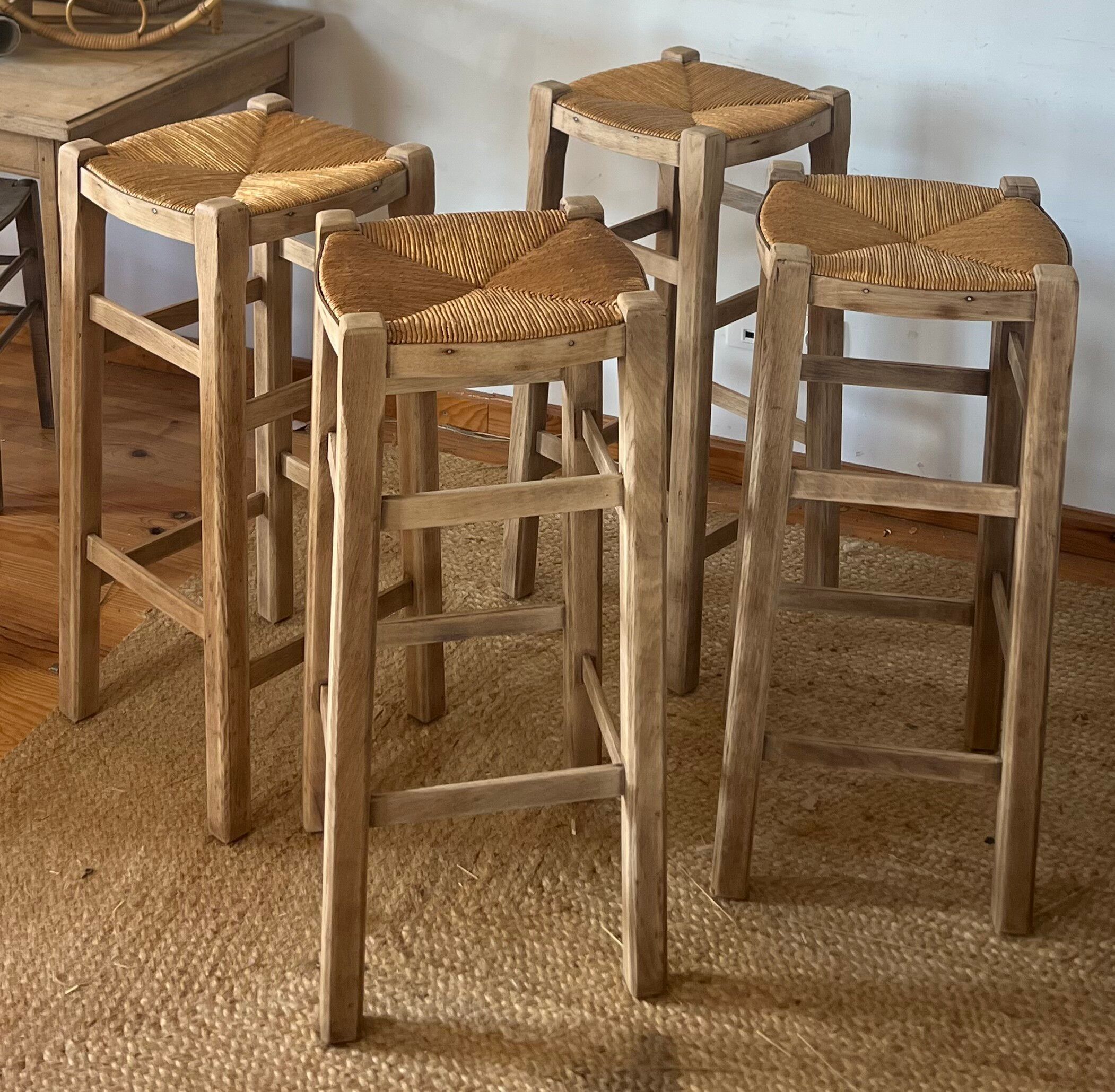 Set of 4 vintage high bar stools in raw solid oak and straw.