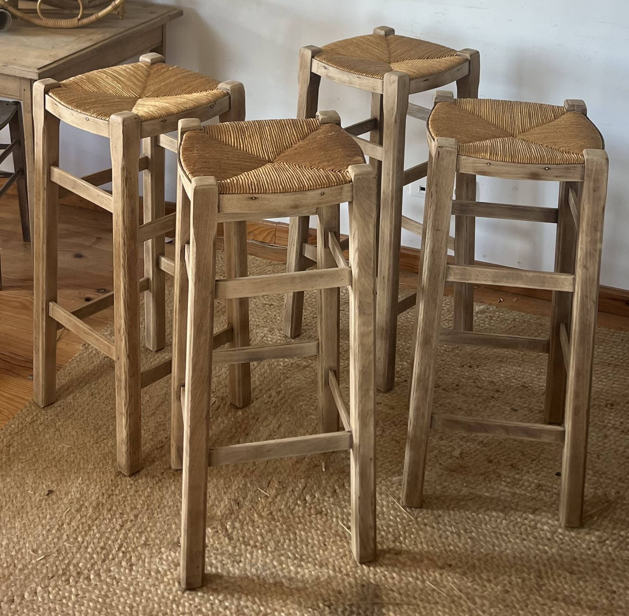 Set of 4 vintage high bar stools in raw solid oak and straw.