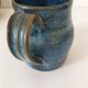Set of artisanal ceramics in shades of blue.
