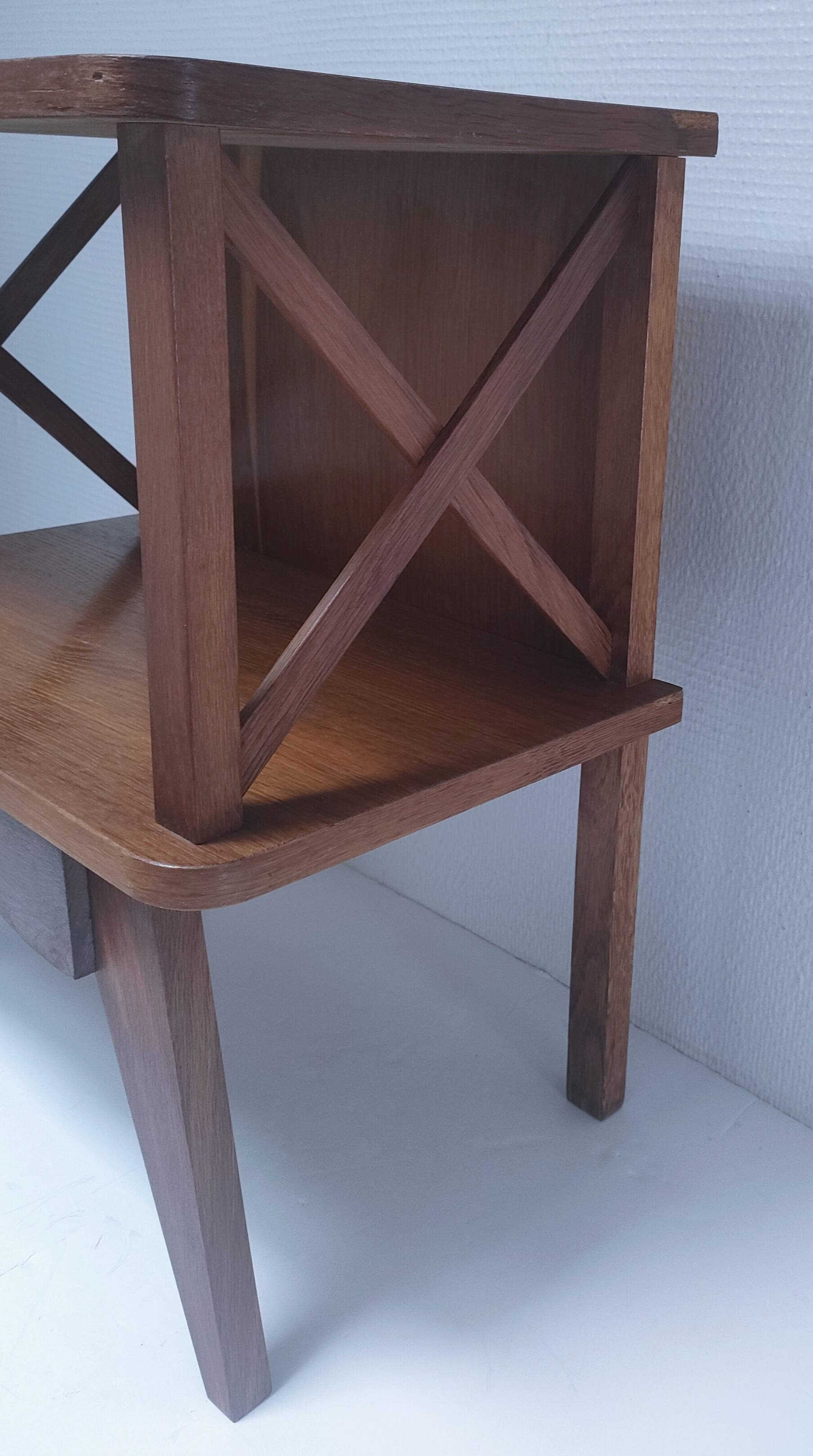 vintage wooden bedside table with crossbars and tapered legs