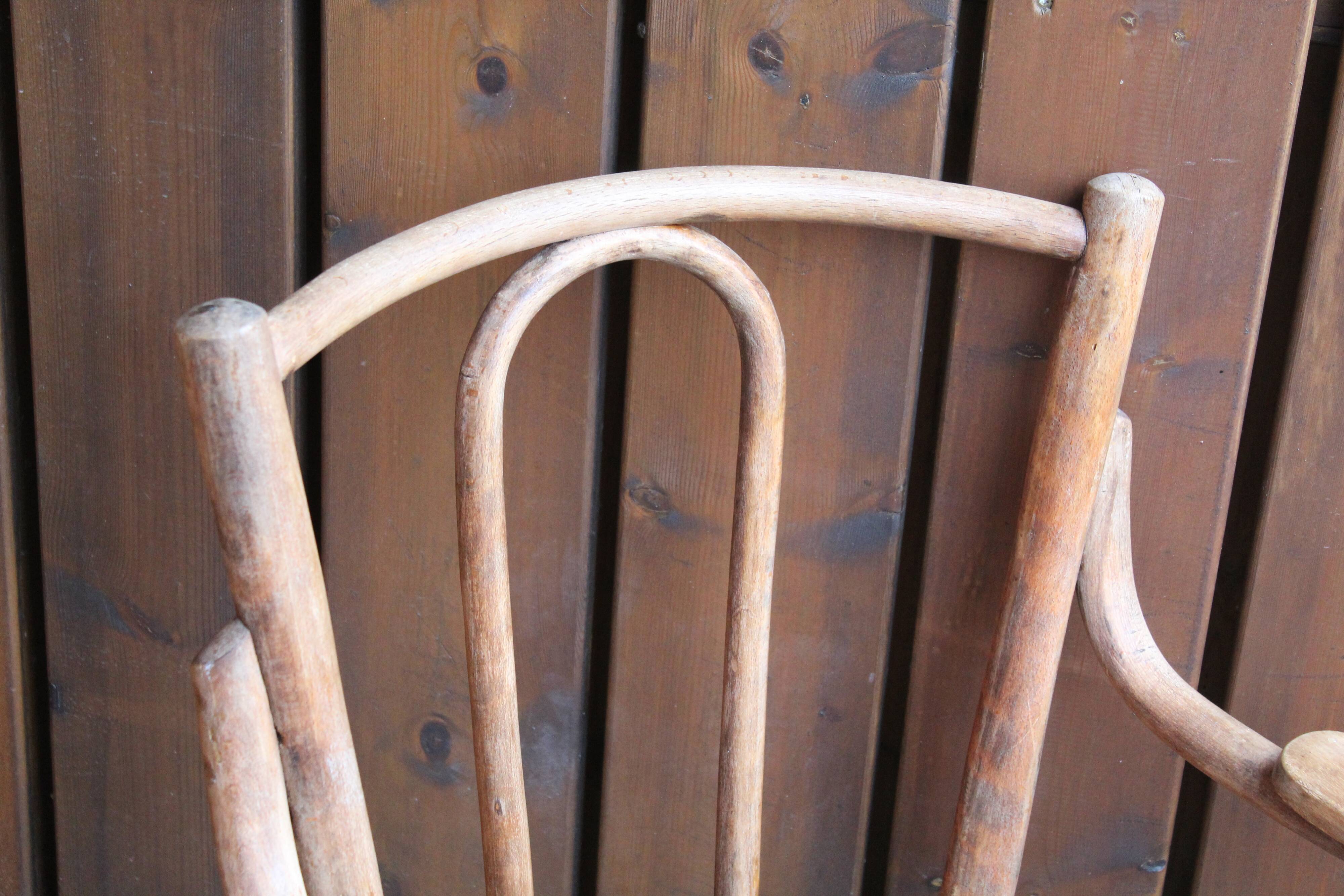 Curved wooden armchair
