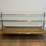 Coffee table in brass, brushed steel, glass, and gilded eglomisé mirror from Maison Jansen.