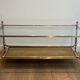 Coffee table in brass, brushed steel, glass, and gilded eglomisé mirror from Maison Jansen.