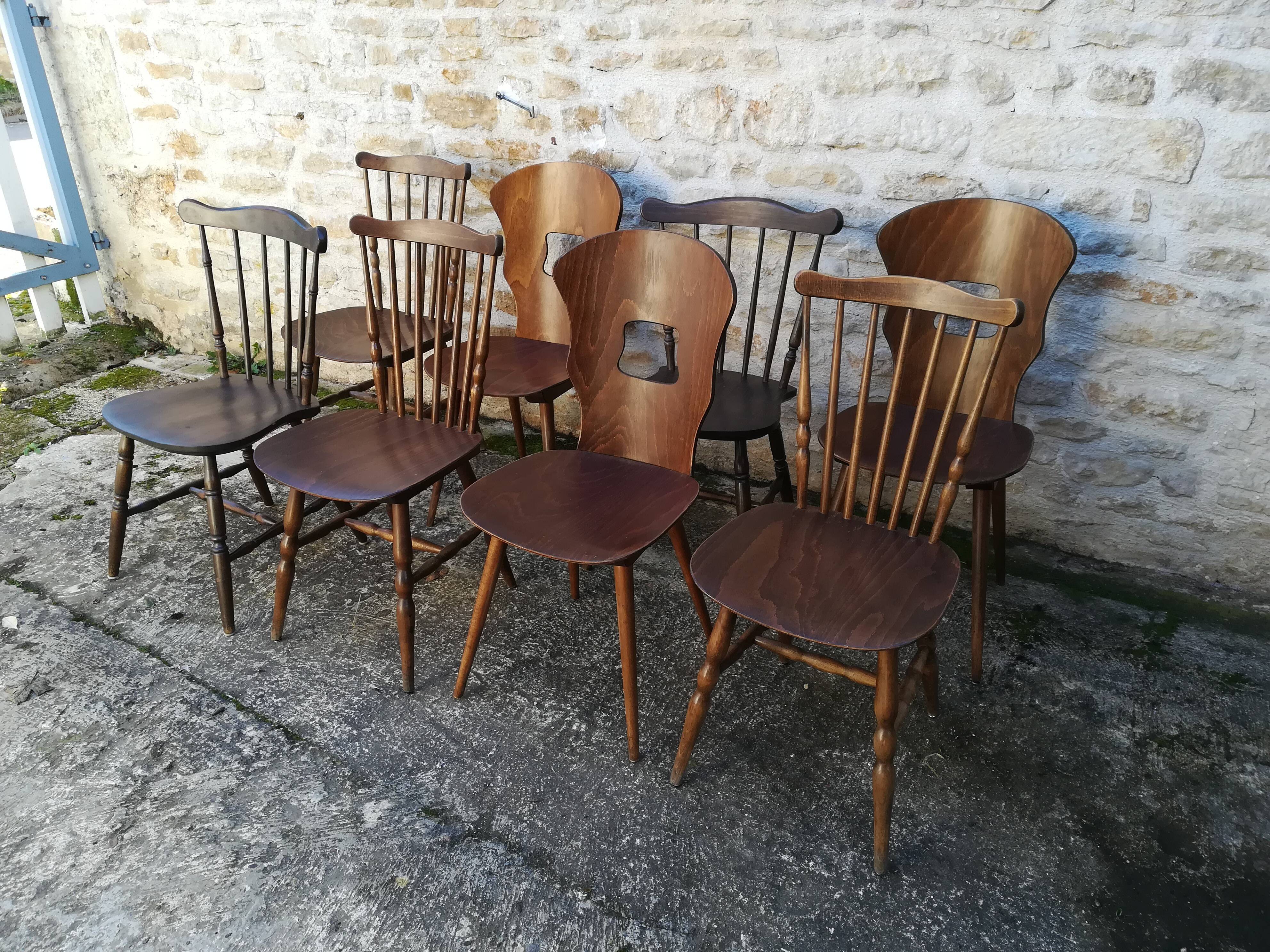 Eight mismatched bistro chairs