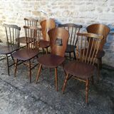Eight mismatched bistro chairs