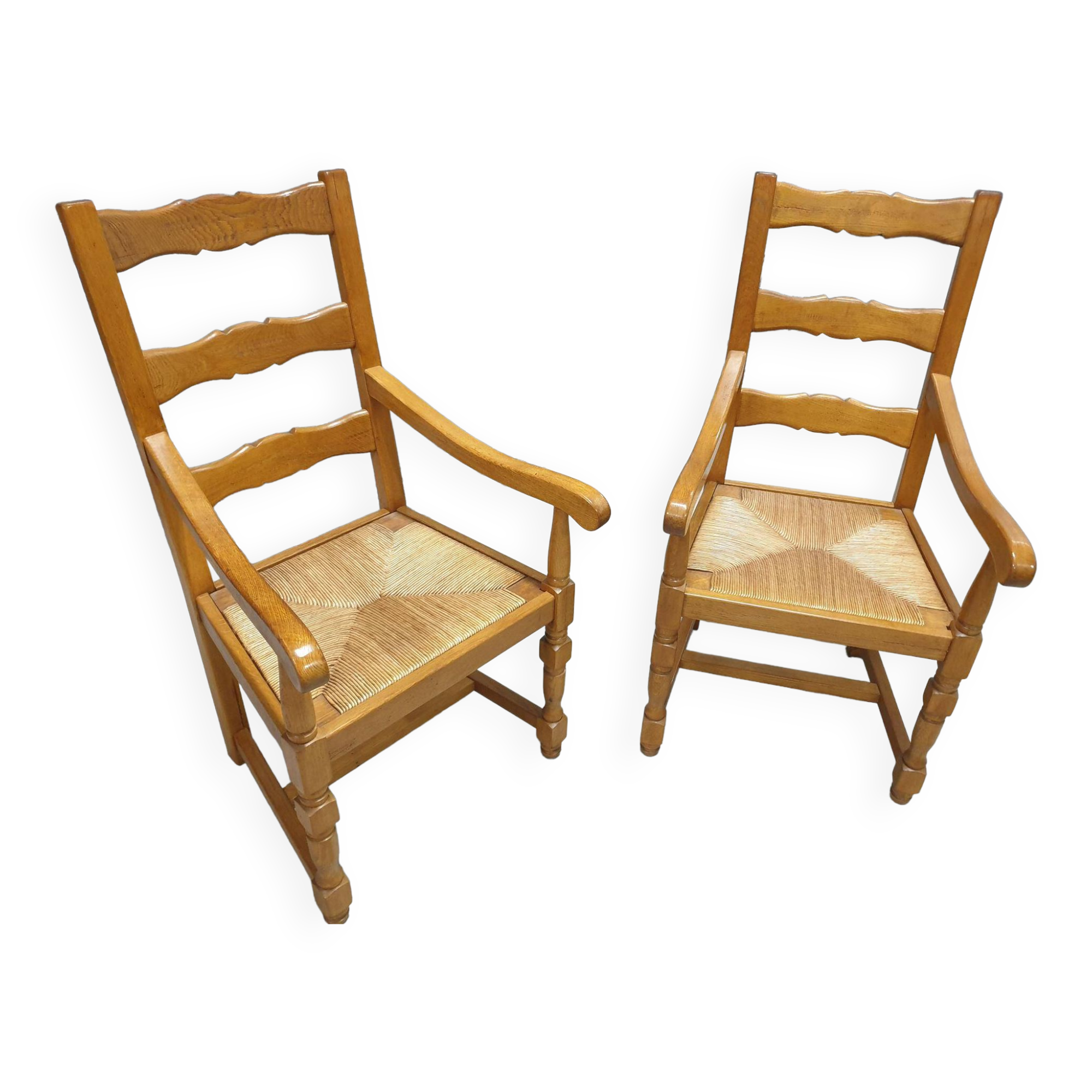 Two oak armchairs with straw seats