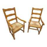 Two oak armchairs with straw seats