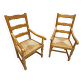 Two oak armchairs with straw seats