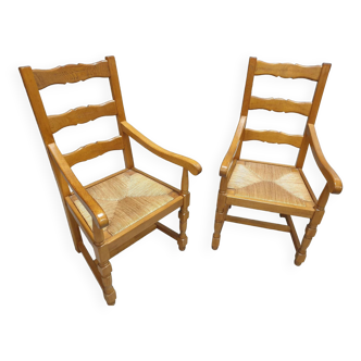Two oak armchairs with straw seats