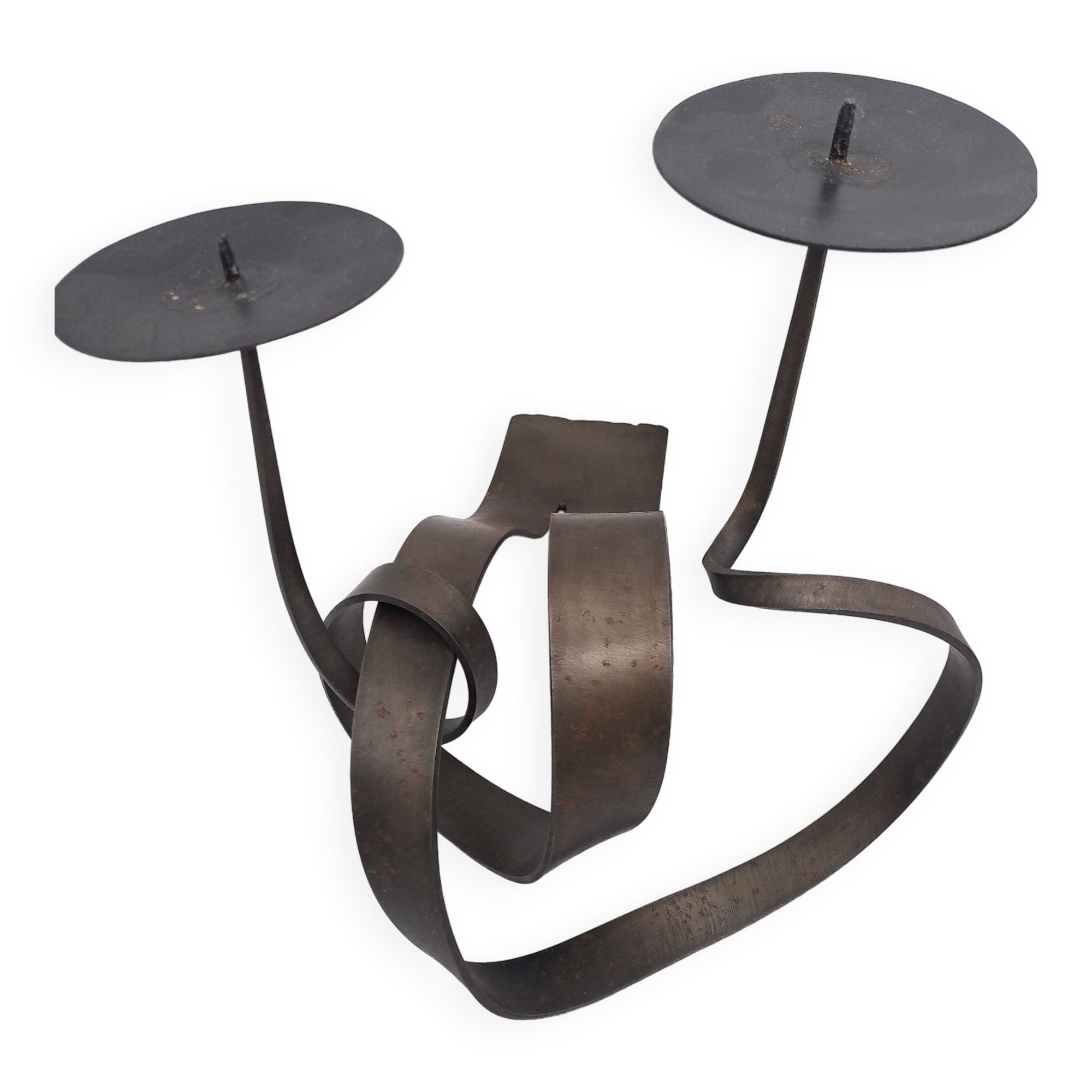 Brutalist candle holder in bronze effect metal.