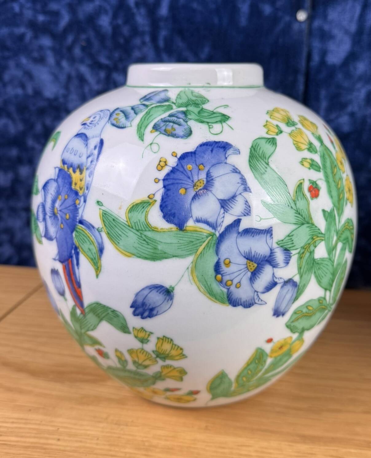 China circa 1900: pair of porcelain ball vases with birds and flowers