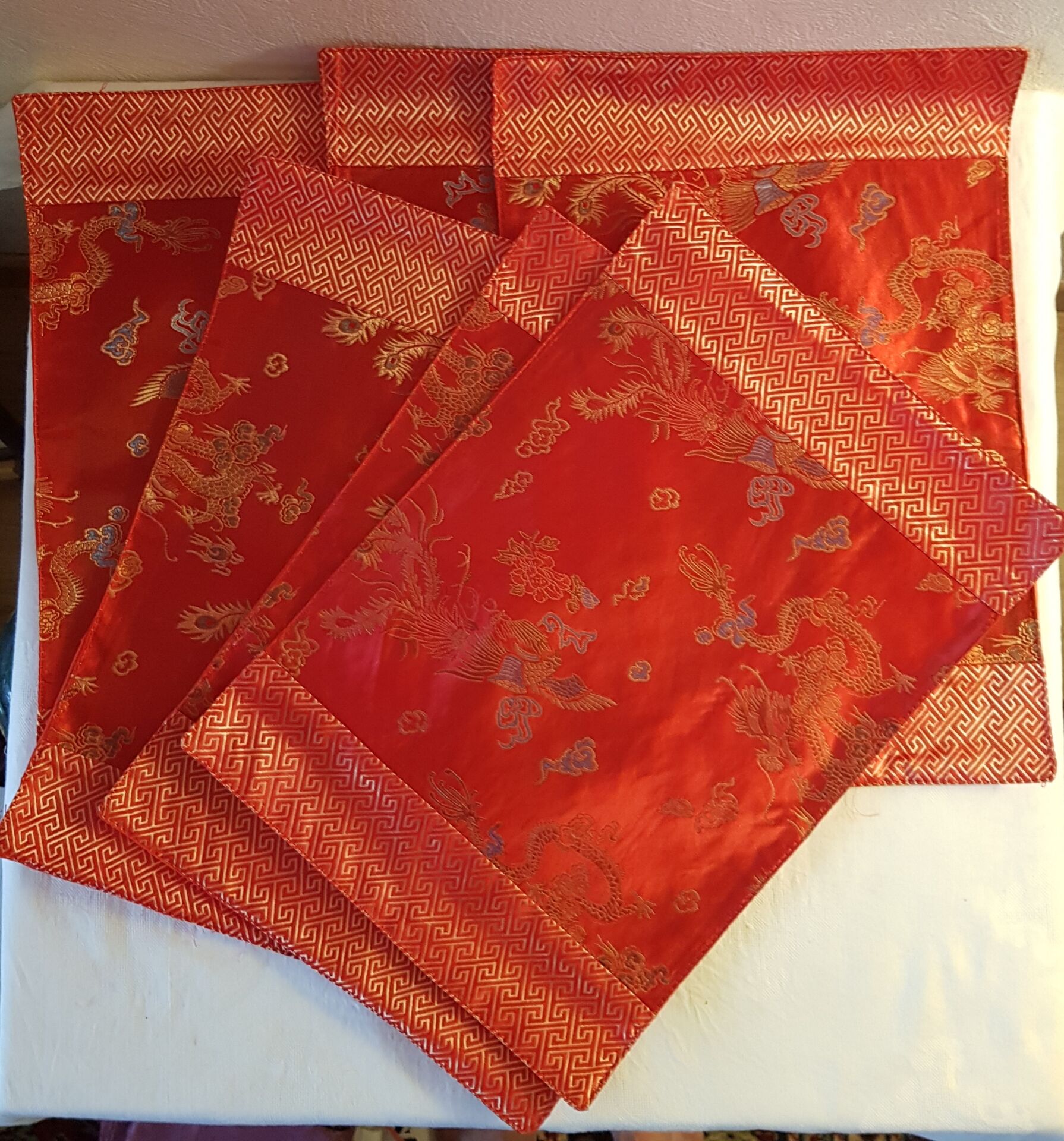 Set of 6 small table napkins in red brocade.