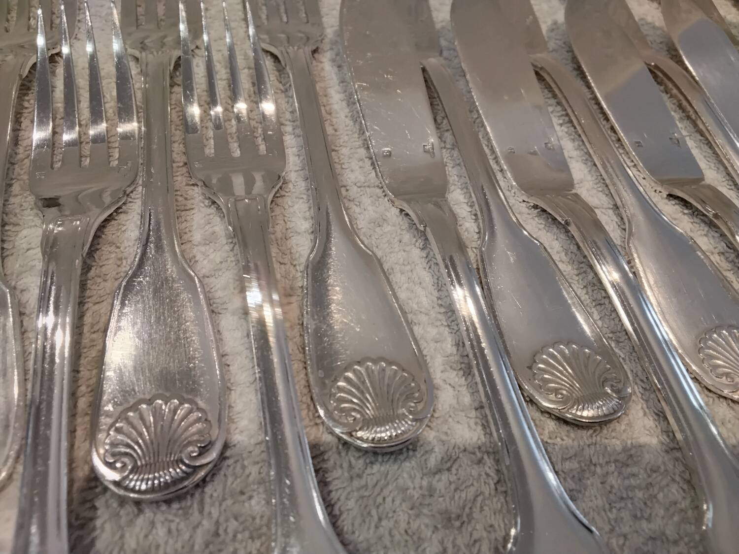 11 silver-plated fish forks and 11 fish knives by Christofle Vendome