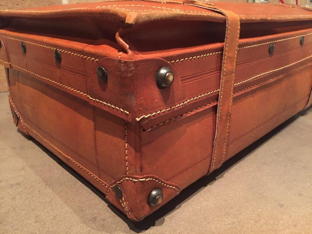 Thick leather suitcase