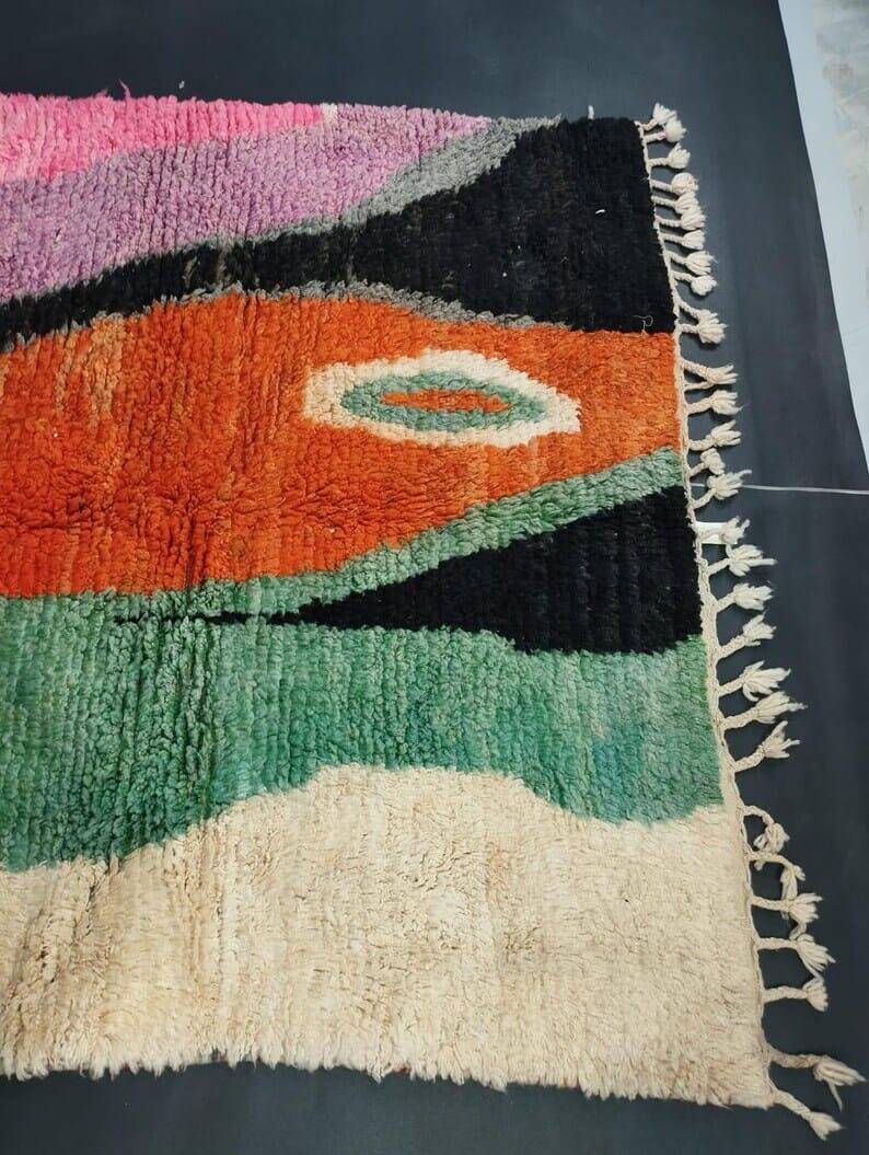 Large handmade Moroccan rug with colourful patterns.