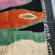 Large handmade Moroccan rug with colourful patterns.