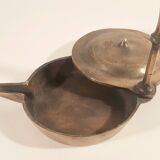 Old oil lamp in golden brass to hang