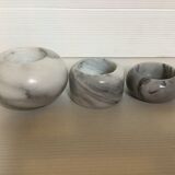 9 marble candle holders of different sizes