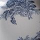 Antique mismatched earthenware soup plates with a tureen