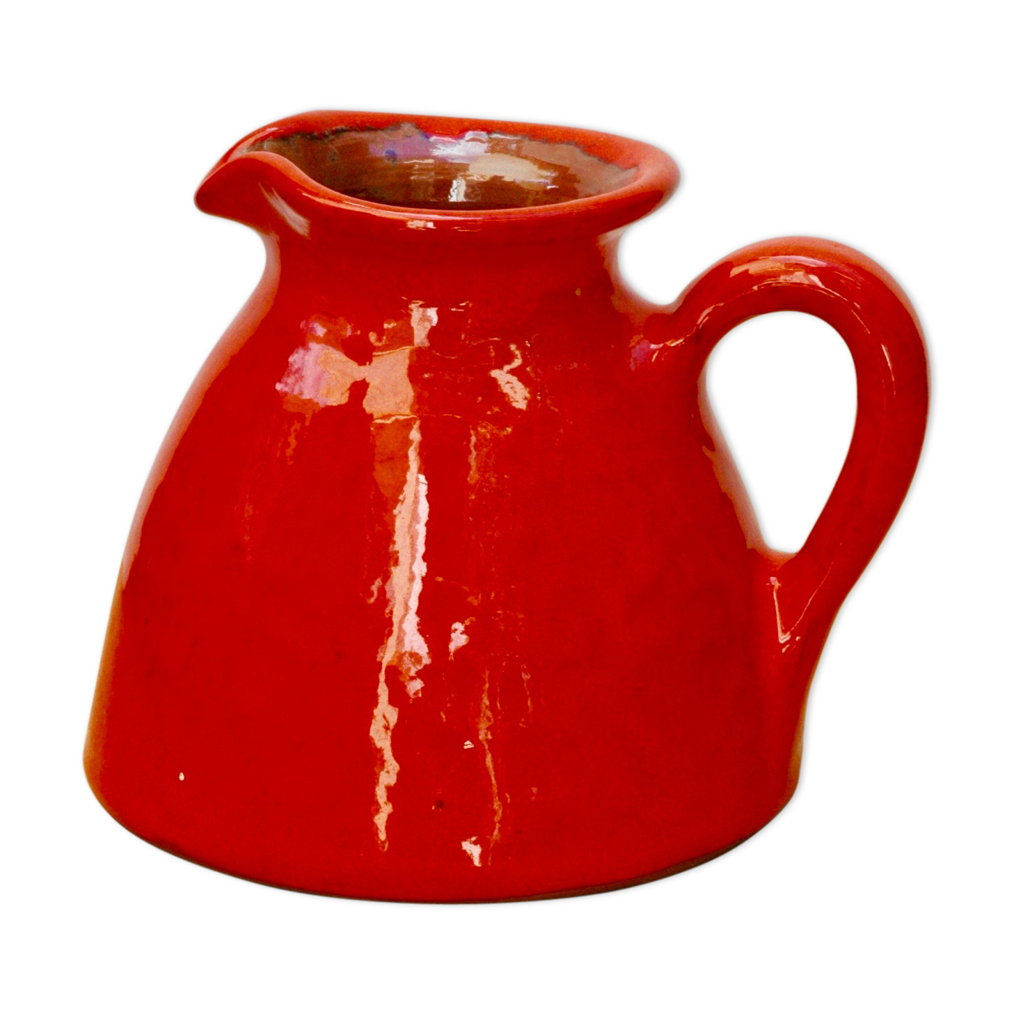 Orange earthen glazed pitcher