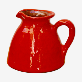 Orange earthen glazed pitcher