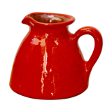Orange earthen glazed pitcher